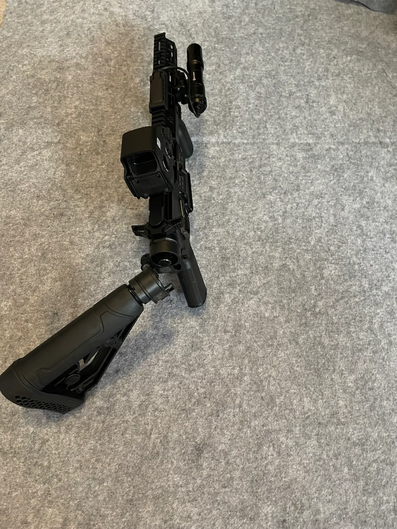 Custom AR rifle build on workbench